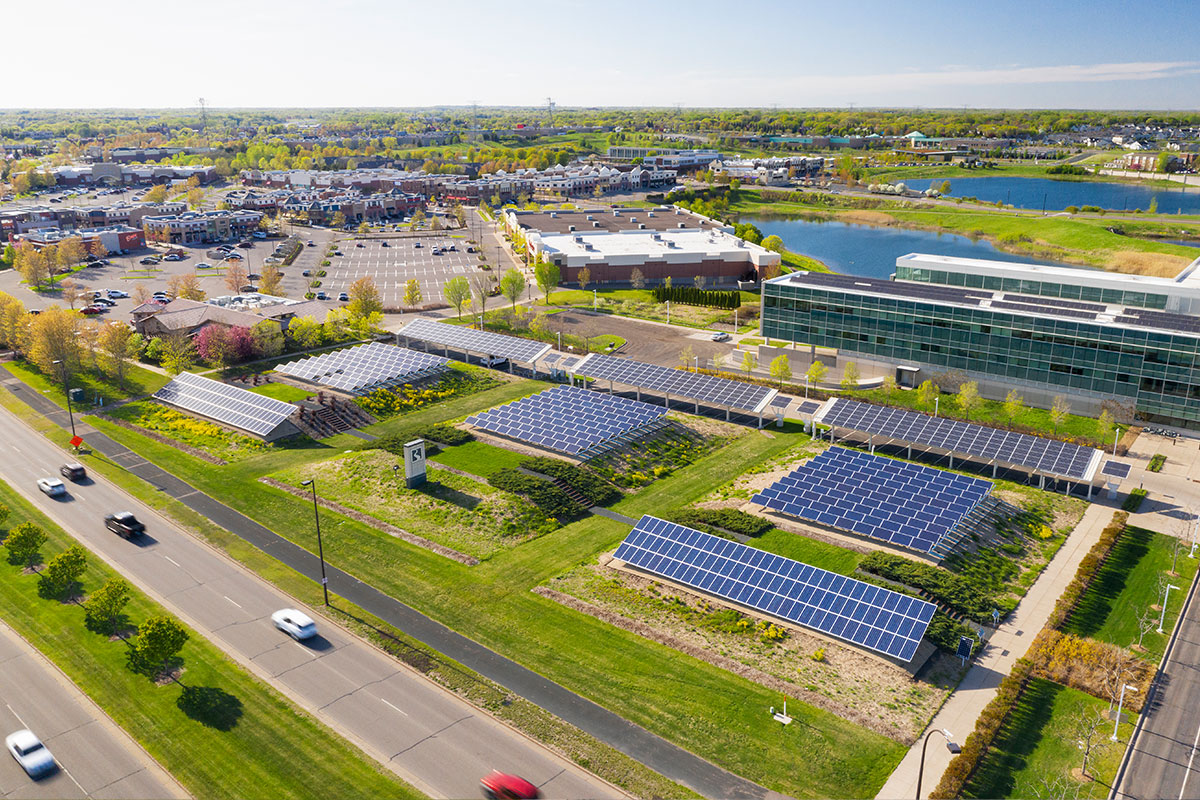 Solar panels along Minnesota highway, corporate communication drone photography